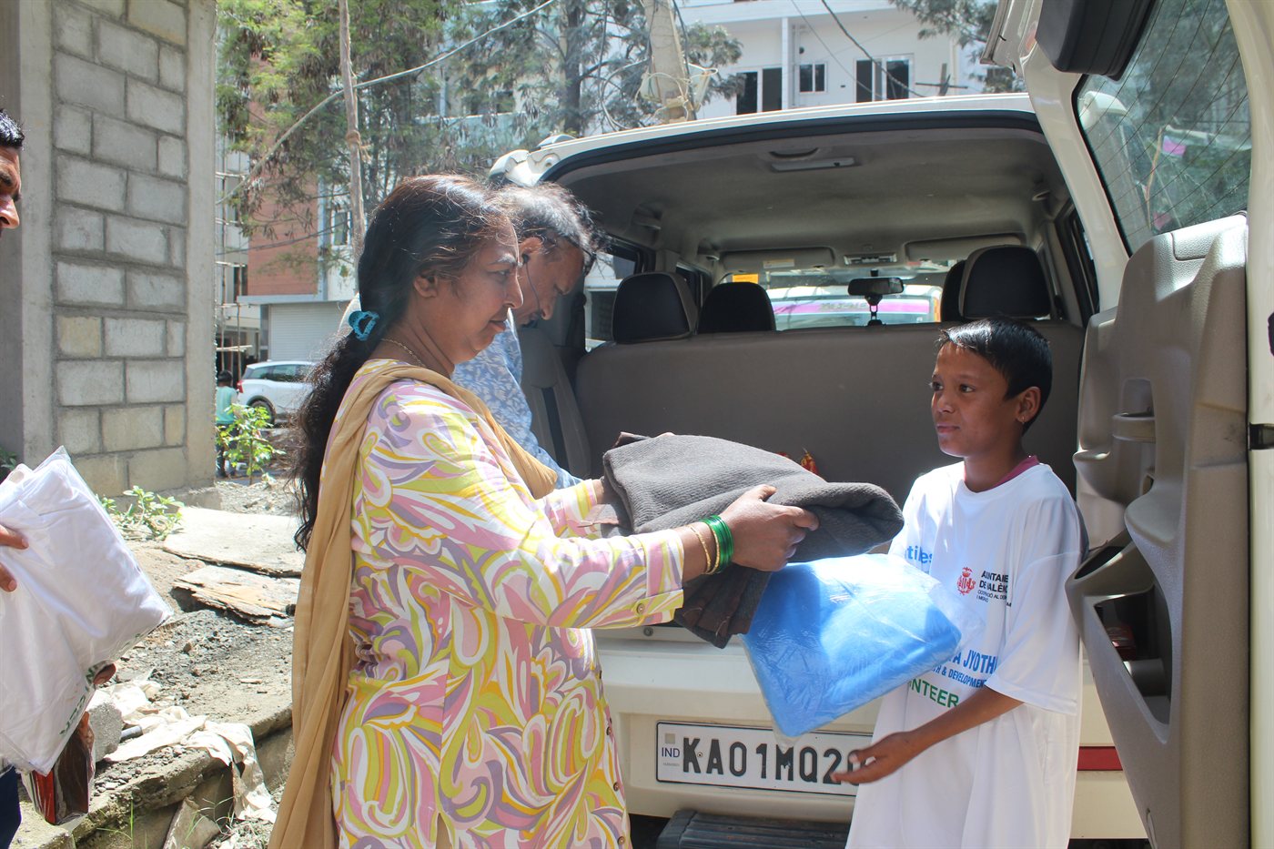 Distribution of supplementary food grain bags to community members