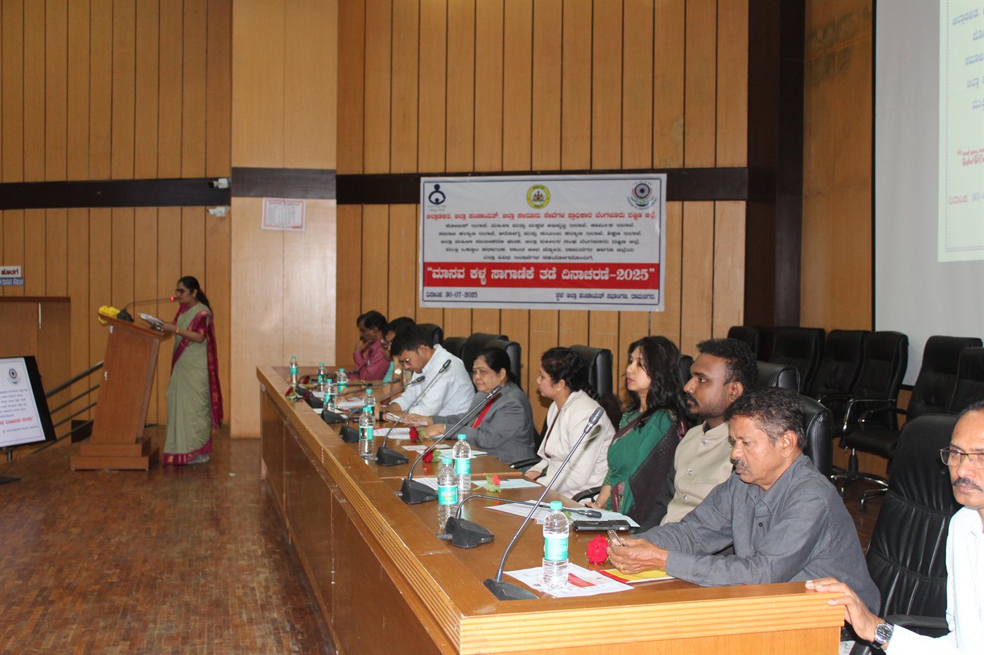 Anti-Human Trafficking convention stage with judges and administration