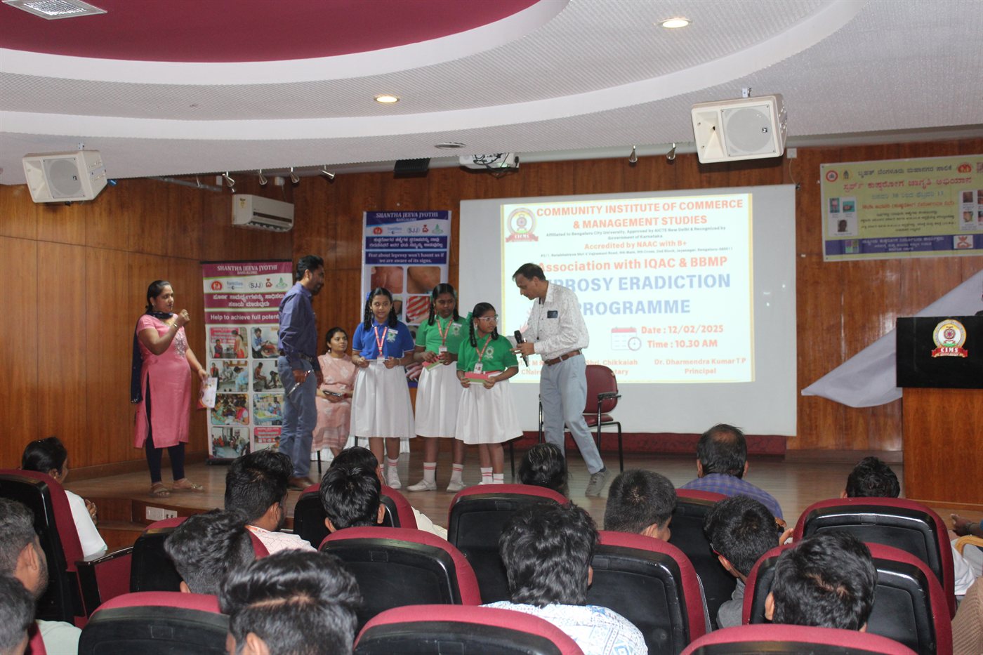 School students receiving awards for health awareness quiz